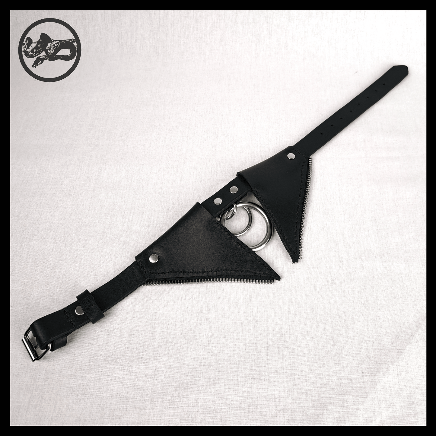 FLEDERTIER – SABBATH choker necklace laid out opened up on a white background, showing the back view of black leather with stainless steel and zinc alloy hardware and handpainted red bat wing ornaments, by skinpressedtight.