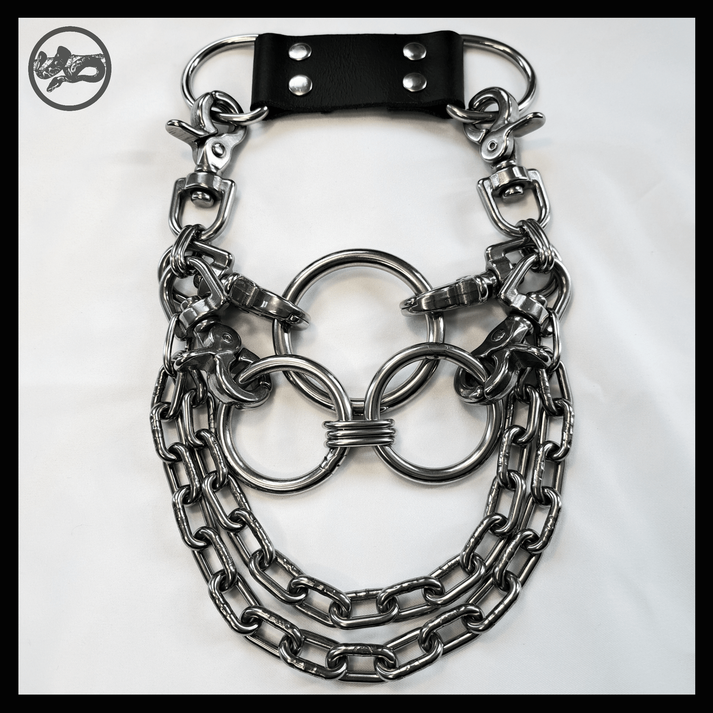 FLAECHENBRAND_brutalist_steel_necklace_with_leather_neckpiece_with_thick_chains_and_layered_rings_laid_out_on_white_background_front_view_skinpressedtight