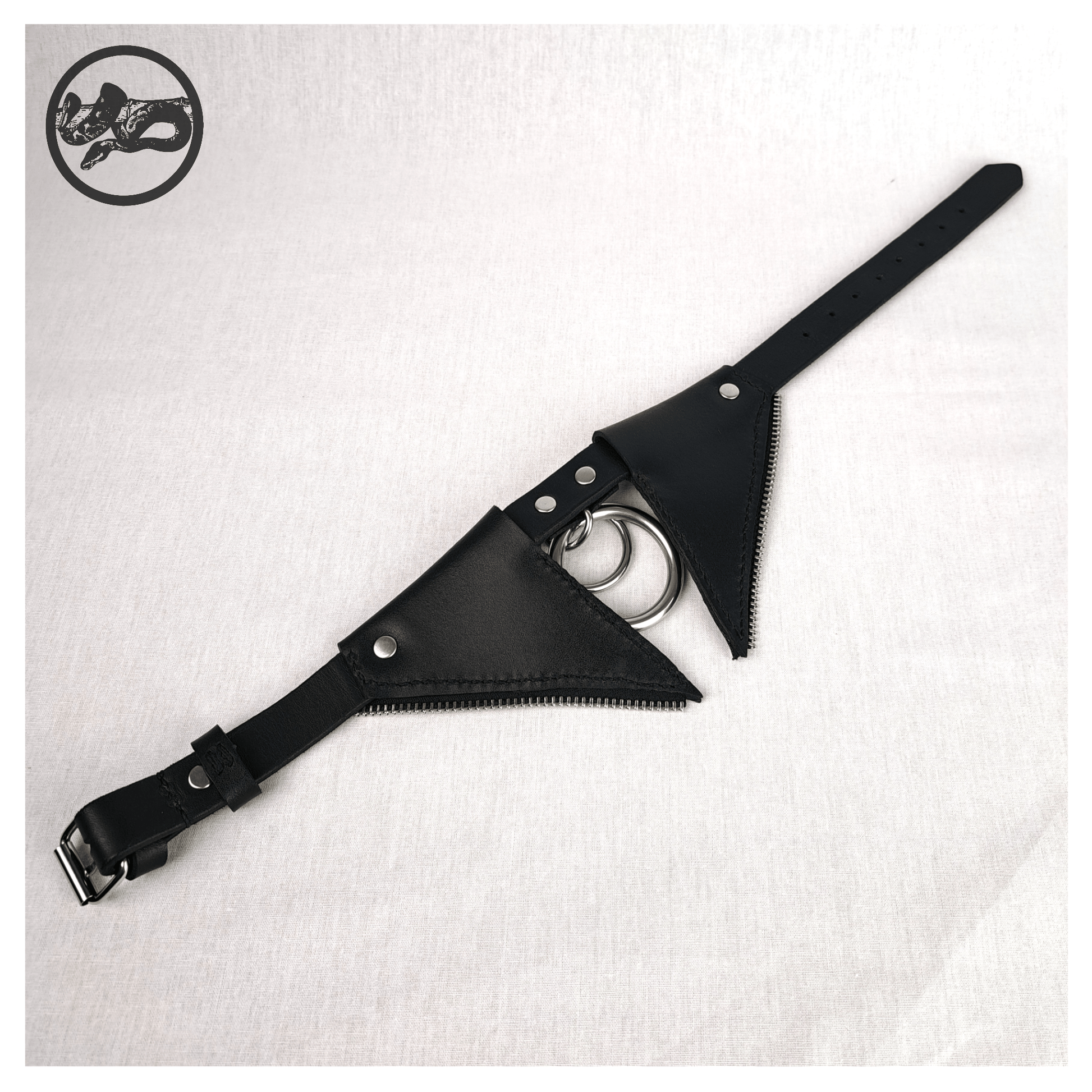 FLEDERTIER – SABBATH choker necklace laid out opened up on a white background, showing the back view of black leather with stainless steel and zinc alloy hardware and handpainted red bat wing ornaments, by skinpressedtight.