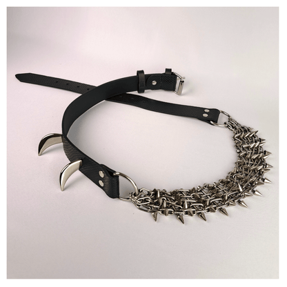 KLINGENSÄNGER — VIPER edition belt laid out on white background, featuring black viper print leather, metal chainspike hardware, and prominent fang studs — handcrafted gothic statement piece by skinpressedtight