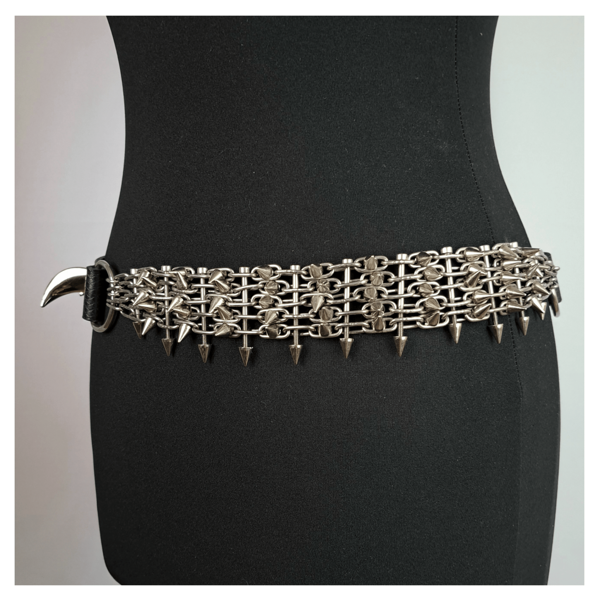 KLINGENSÄNGER — VIPER edition belt left side view on black mannequin, featuring black viper print leather, metal chainspike hardware, and fang studs — gothic handcrafted accessory by skinpressedtight