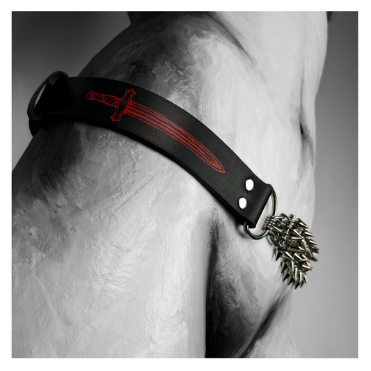 KLINGENSĀNGER – BLADE belt worn on a painted mannequin, black and white: black leather strap with a painted blade and a panel of spiked chain at the hip. Handmade by skinpressedtight