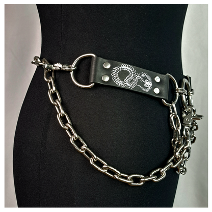 VIPERNZIRKEL – BONES chain belt on a dress form, other side: painted snake-skeleton tab, D-ring and chain round the hip. Handmade by skinpressedtight